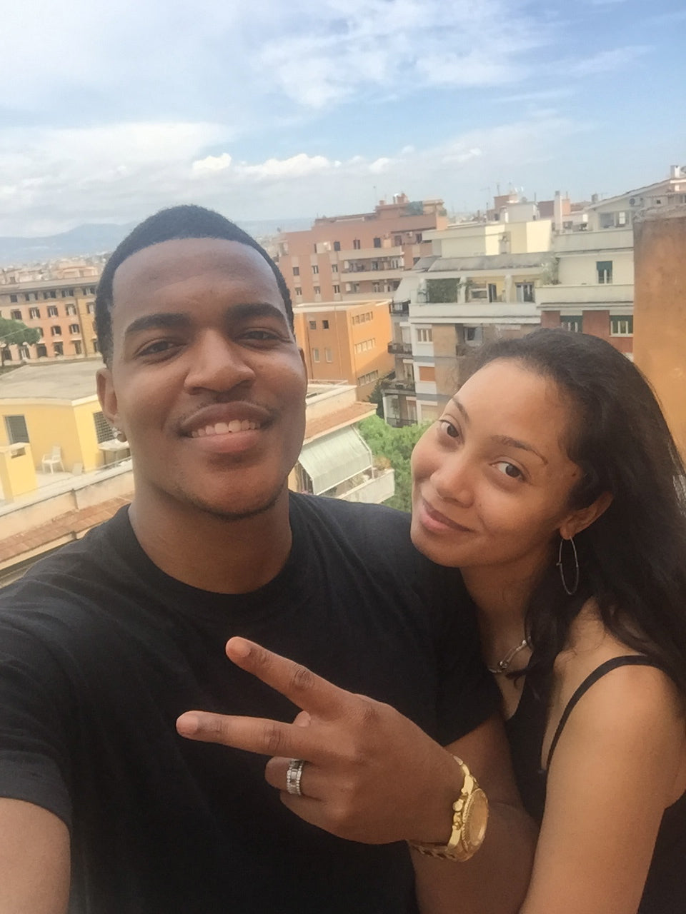Jasmine and Dione smiling on a Rome rooftop